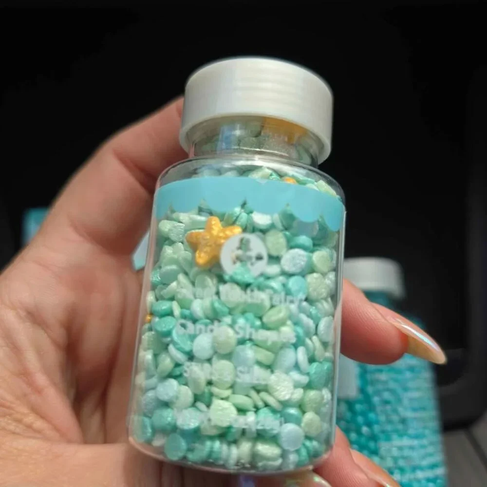 Mermaid tail cake toppers woth 2 jars of sprinkles. New in box Mermaid birthday